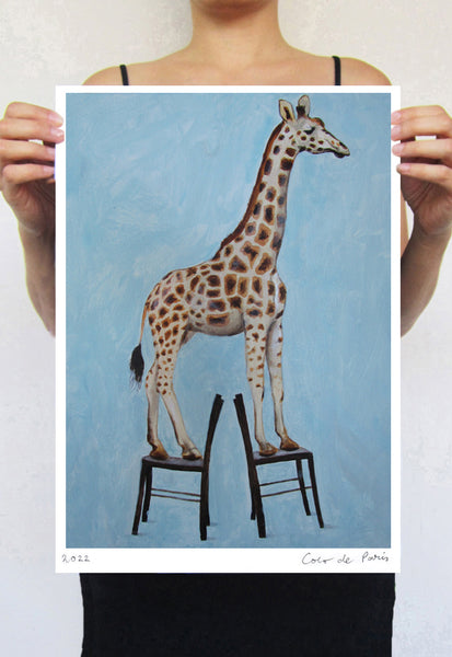 Giraffe standing on 2 chairs Art Print by Coco de Paris
